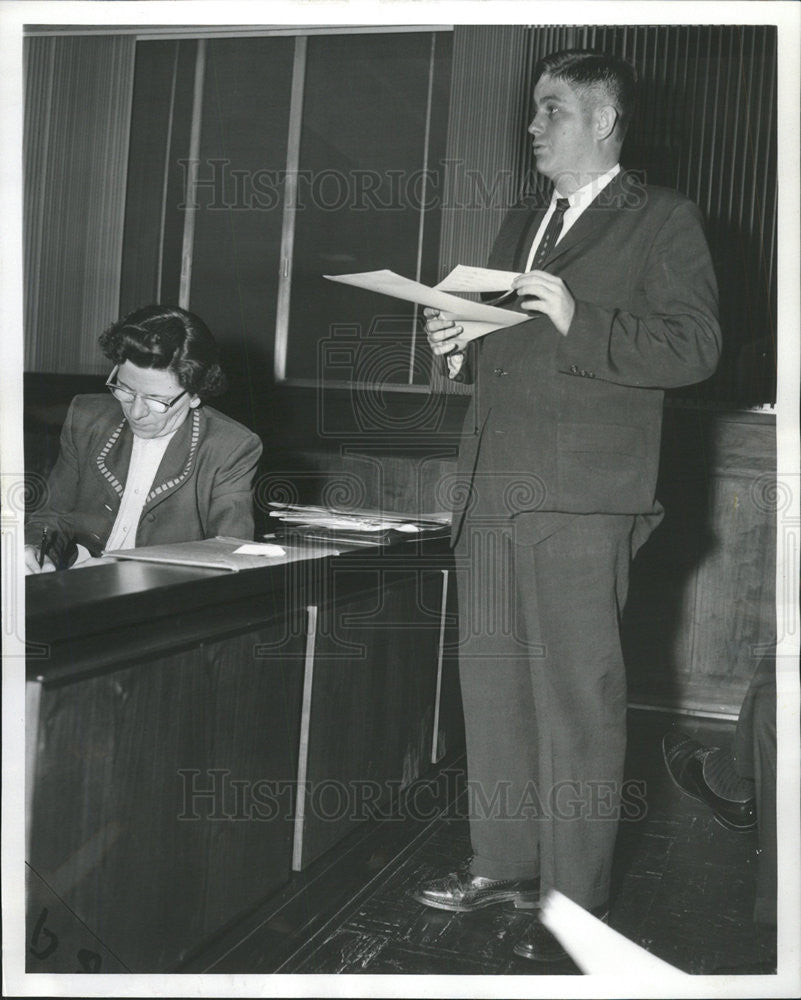 1958 Press Photo William McGah Jr asst corp councel of Skokie reads report - Historic Images