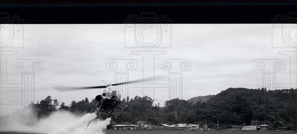 Press Photo Agricutlure in Japan helicopters spraying insecticides - Historic Images