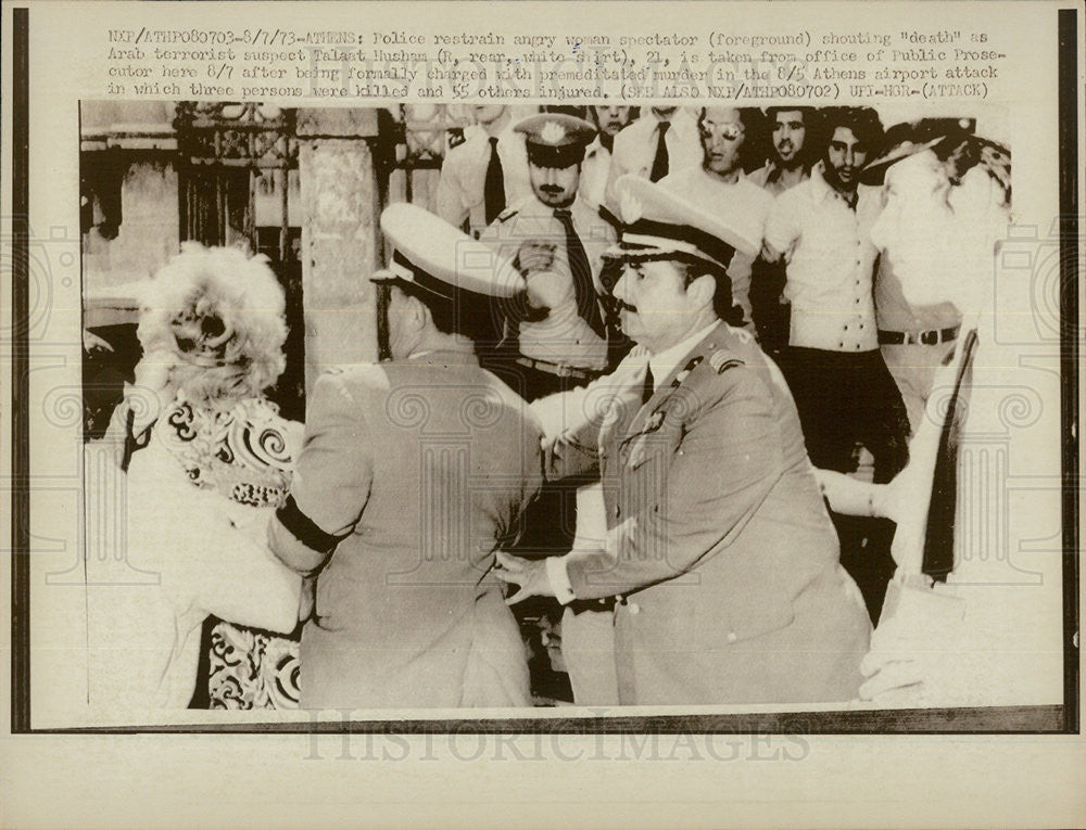 1973 Press Photo Woman Restrain by Police as Terrorist taken from Prosecutor - Historic Images