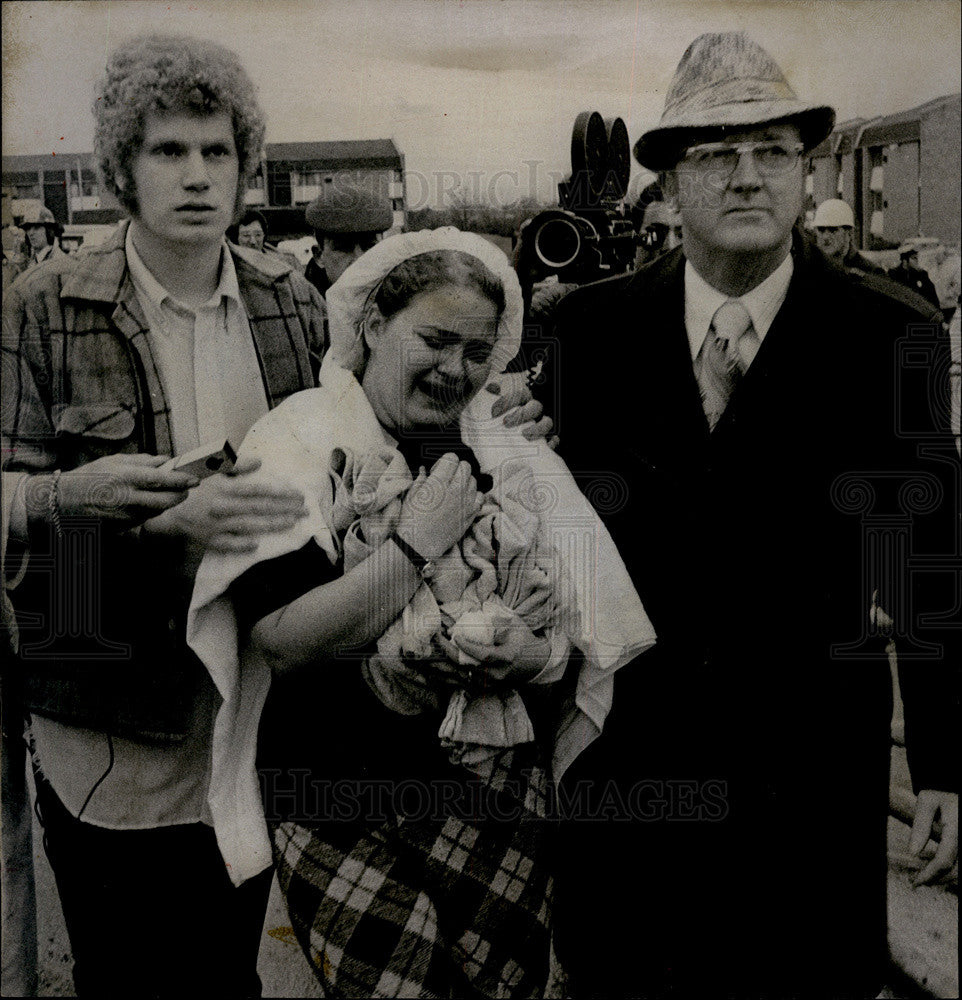 Press Photo Tom Jensen and Wife Madeline Led From Damaged Building - Historic Images