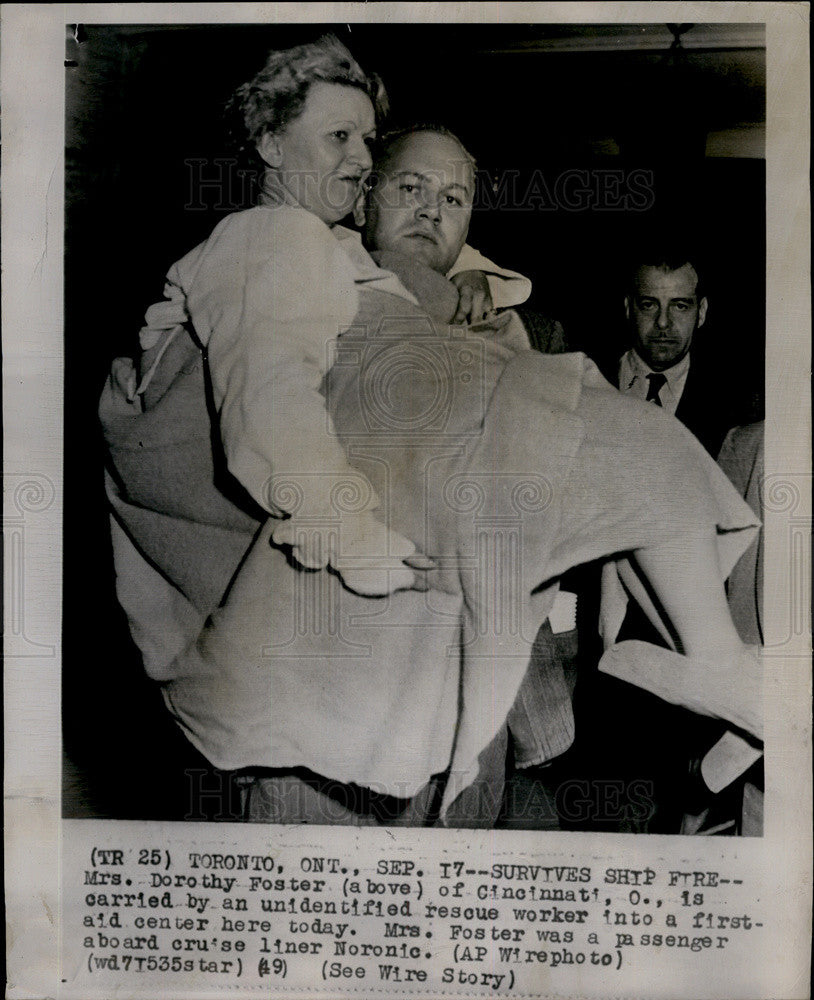 1949 Press Photo Fire Survivor Carried to Aid Center By Rescuer - Historic Images