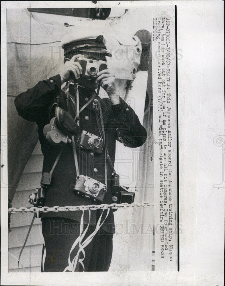 1957 Press Photo Japanese Sailor Snaps Photos While Arriving In Seattle - Historic Images