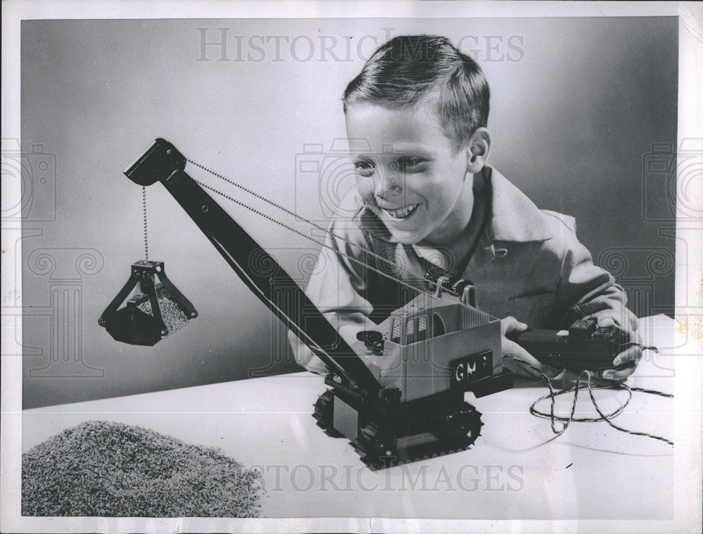 1955 Press Photo Young Boy Playing With New &quot;Electric Magnetic Crane&quot; - Historic Images