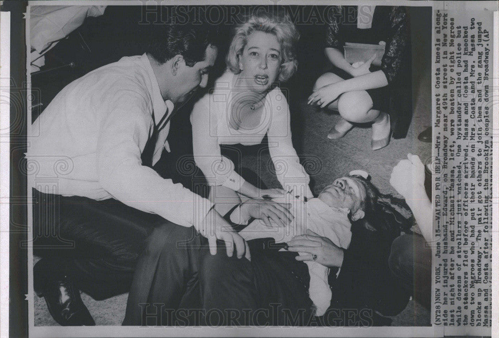 Press Photo Margaret Costa kneels by her injured husband who was beat by Negros - Historic Images