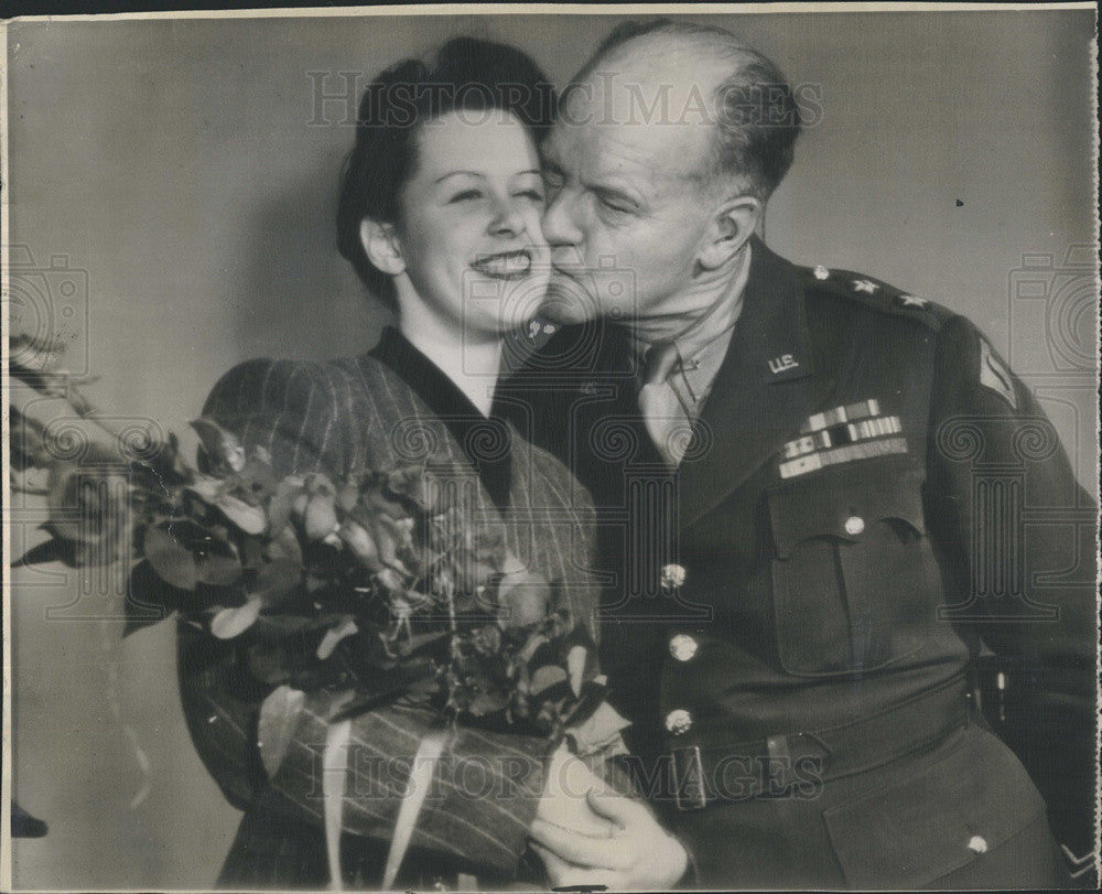 1945 Press Photo Major Gen. Sherman Miles Gives Flowers and Kiss to Kay Runnals - Historic Images