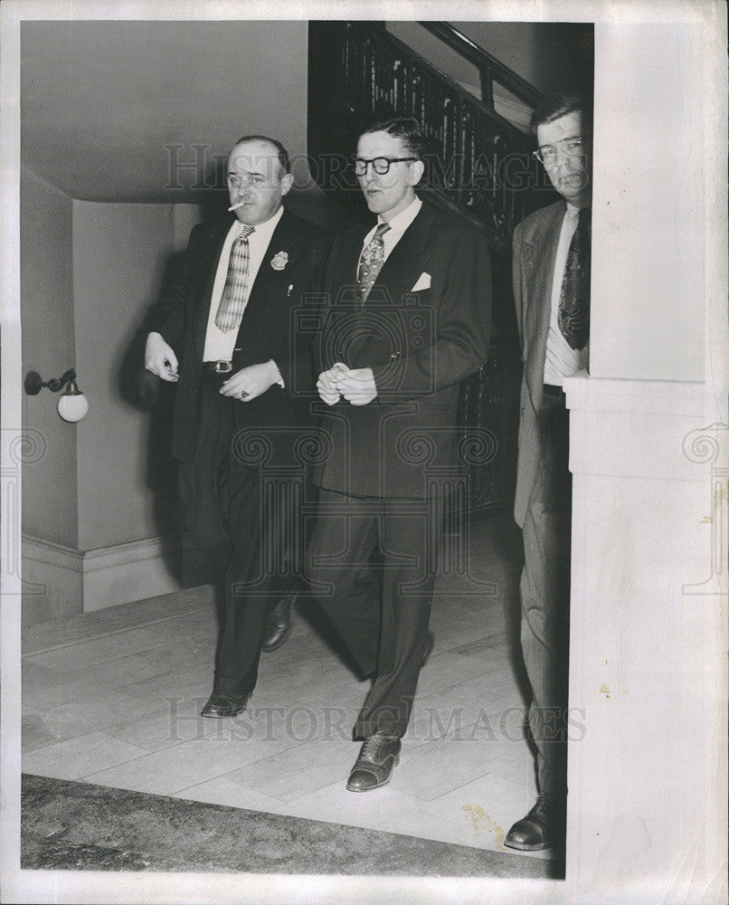 1953 Press Photo Deputy Marshall Stanley Pringle walks out of the court room. - Historic Images