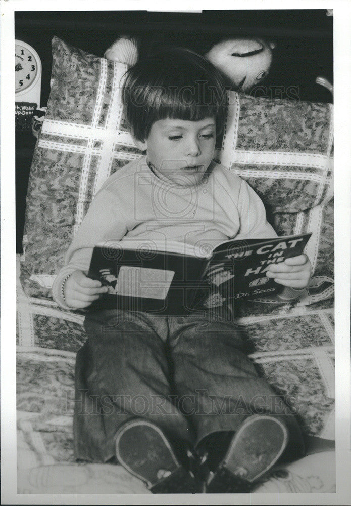 Press Photo boy reads The Cat in the Hat - Historic Images