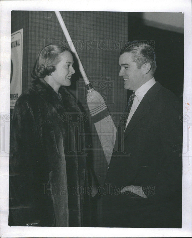 1957 Press Photo Mr. Mrs. W. Donald McSweeney curling broom backdrop chat - Historic Images