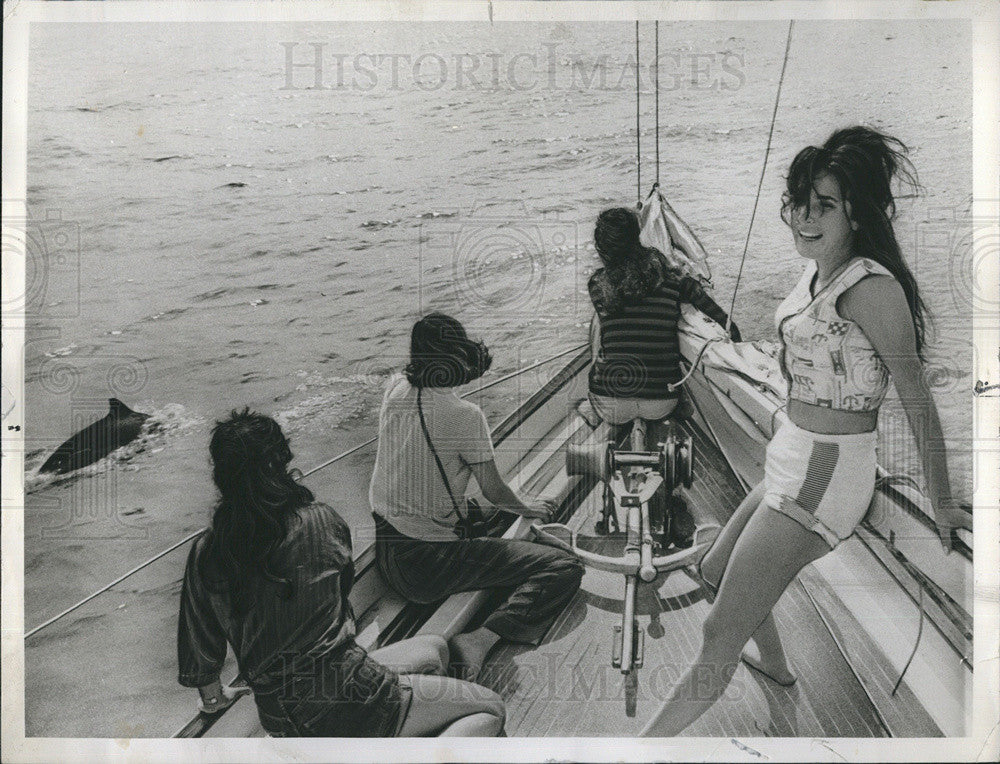 1964 Press Photo Female Crew Of Sailing Boat Looks In Water To See Dolphin - Historic Images