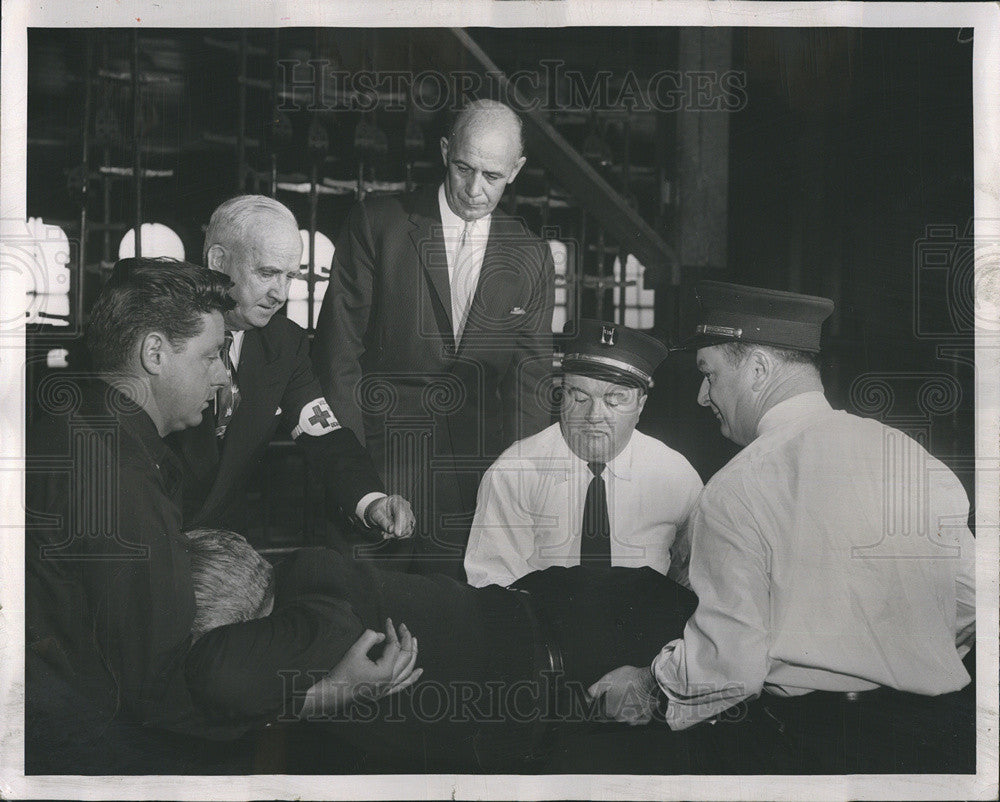 1957 Press Photo Fire Commissioner Robert J Quinn Support Fireman George Graham - Historic Images