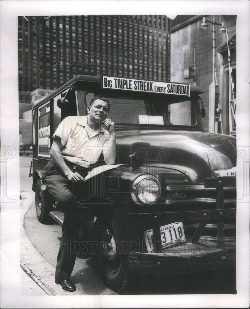 1956 Press Photo Edward Shields Daily News Circulation driver composing song - Historic Images