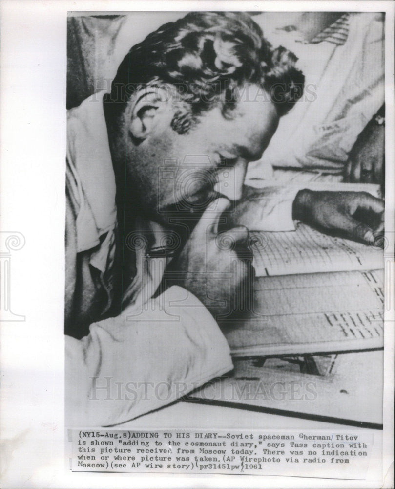 1961 Press Photo Soviet Spaceman Gherman Titov Writing In His Cosmonaut Journal - Historic Images