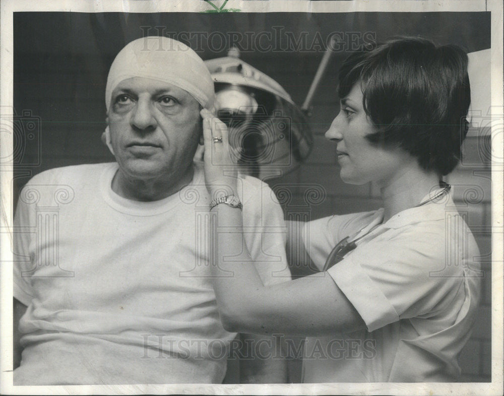 1966 Press Photo John Manus patched up by nurse Kathleen Pearson after whipped - Historic Images