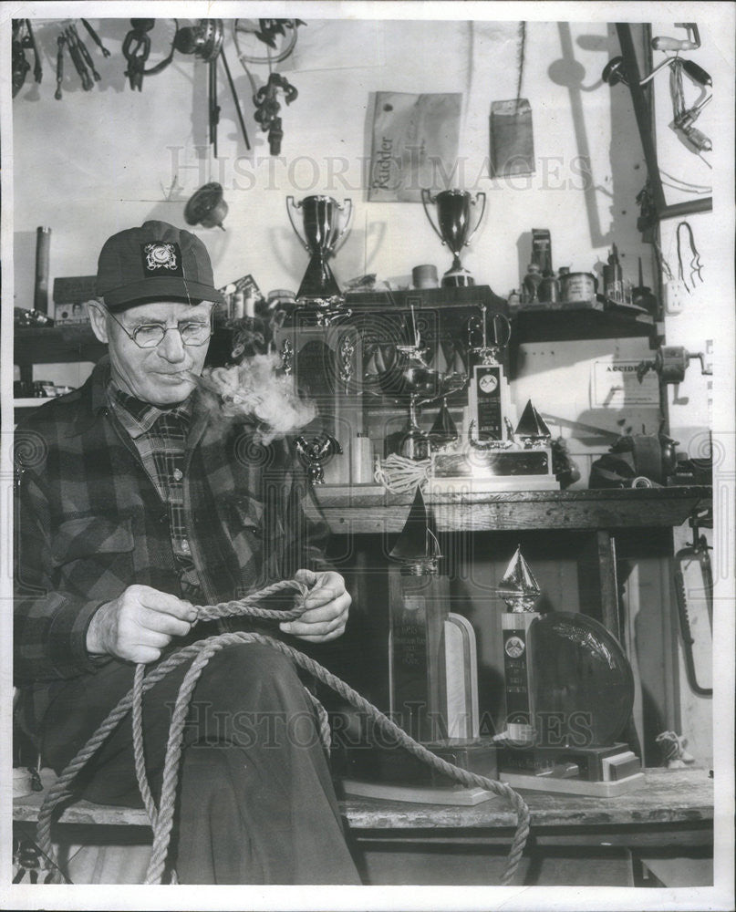 1957 Press Photo Martin L. Nilsen, Sailmaker, splicing sails. - Historic Images