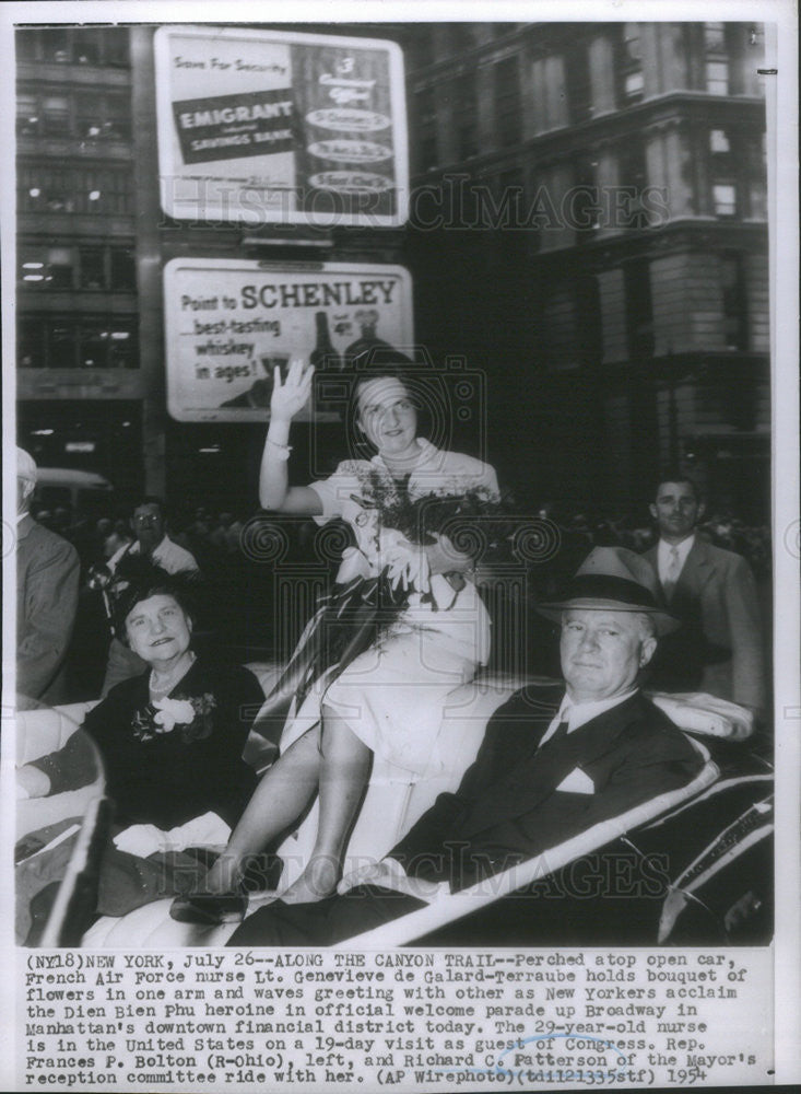 1954 Press Photo Preched atop open car is French Air Force nurse Lt. Genevieve. - Historic Images