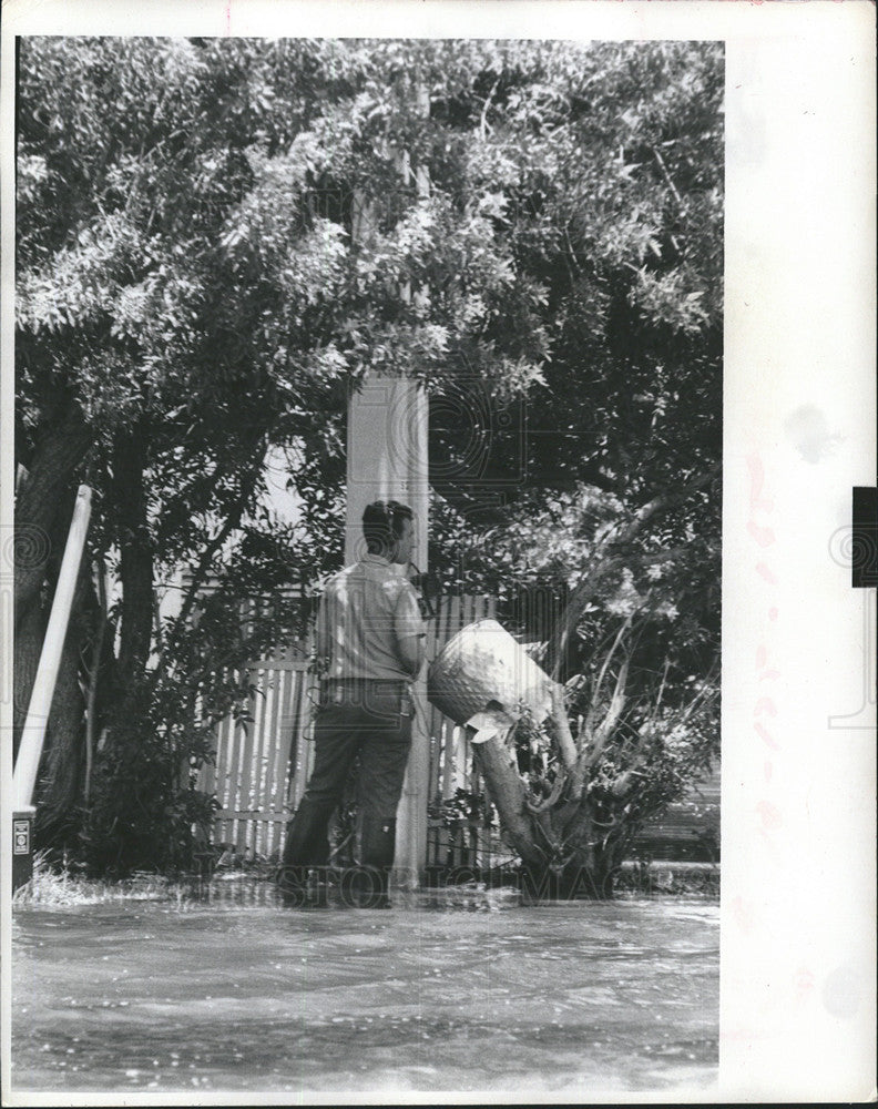 1972 Press Photo Telephone Repairman stands in Water - Historic Images