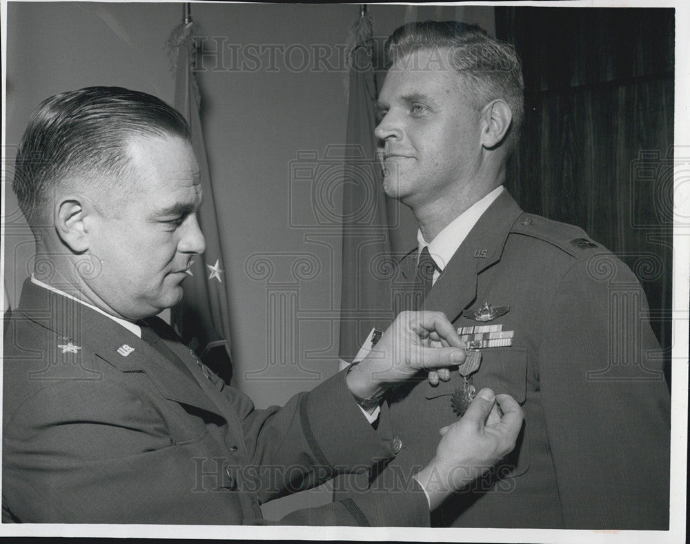 1963 Press Photo Capt John Ford flew 50 combat missions gets medal from Brig Gen - Historic Images