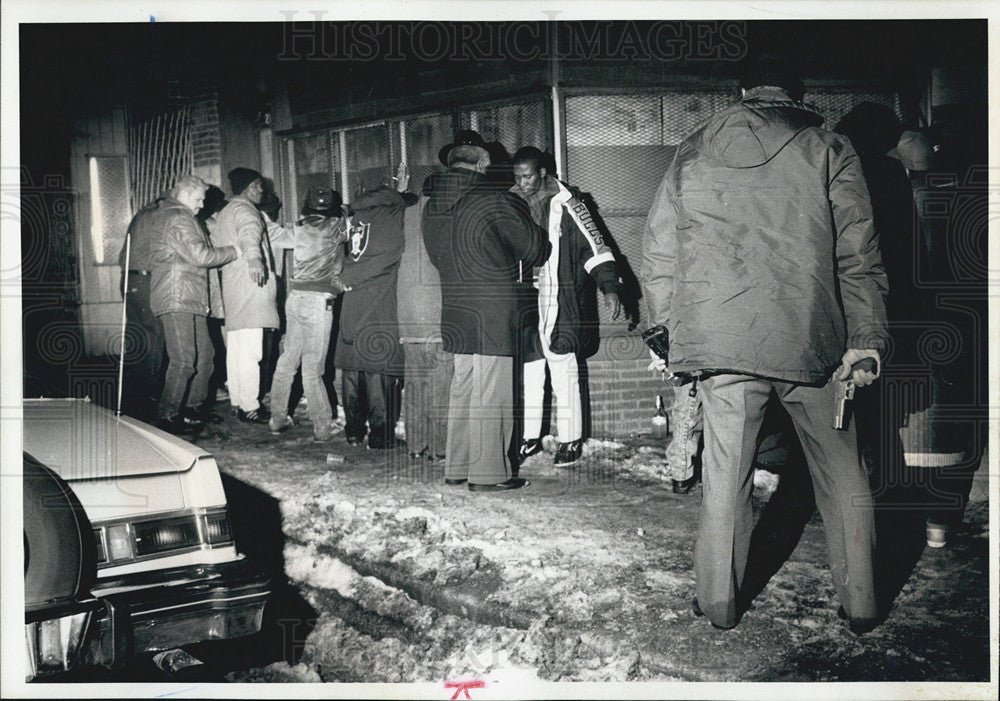 1991 Press Photo Cops Search a Crowd in Relation to Cop Shooting - Historic Images