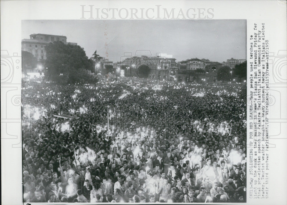 1958 Press Photo People lighting torches for Palmire Tagliatti, communist party - Historic Images