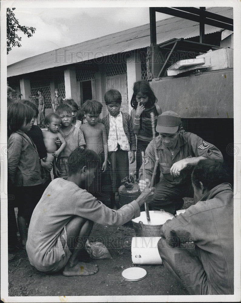 1967 Press Photo Air Force Staff Sergeant Francis Schmidt Helps Montagnard Boy - Historic Images