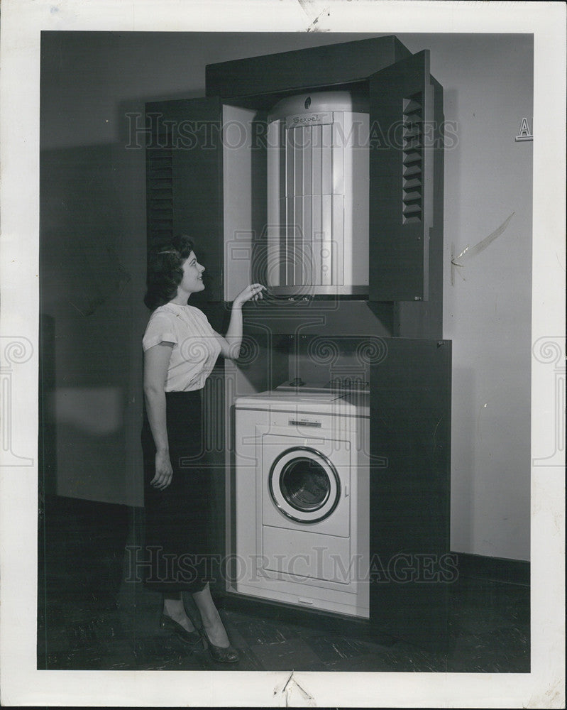 1952 Press Photo Cabinet that can utilized a water heater and washer. - Historic Images