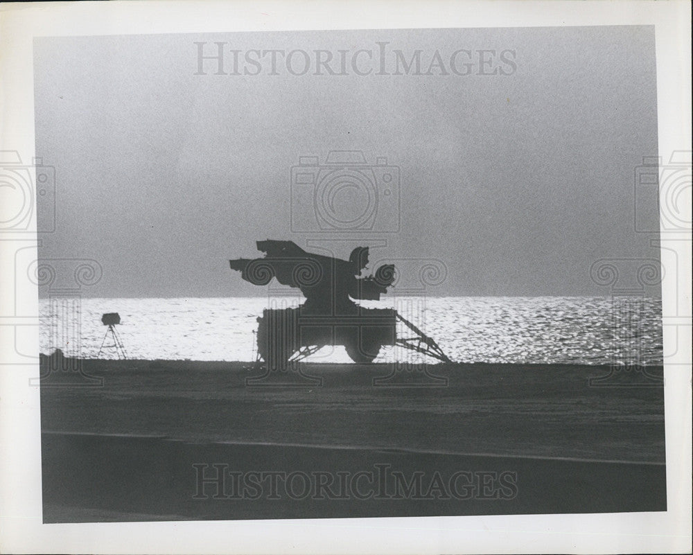 Press Photo A lonely tank on the beach with a plane on top - Historic Images