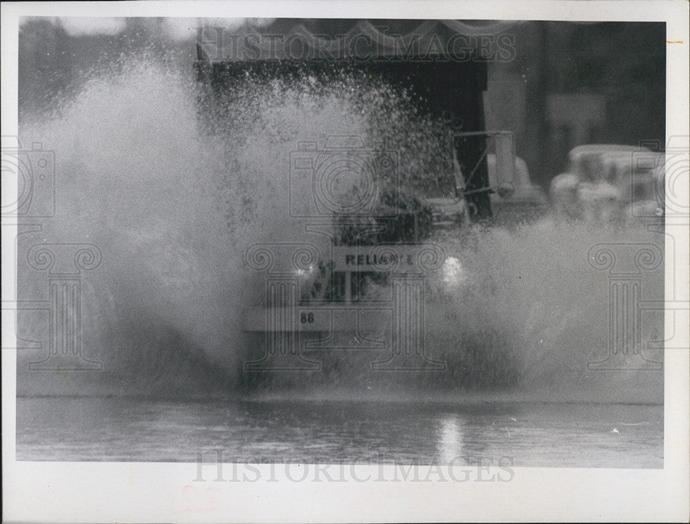 1969 Press Photo Truck Drives Through Flooded Road Pinellas County Florida - Historic Images