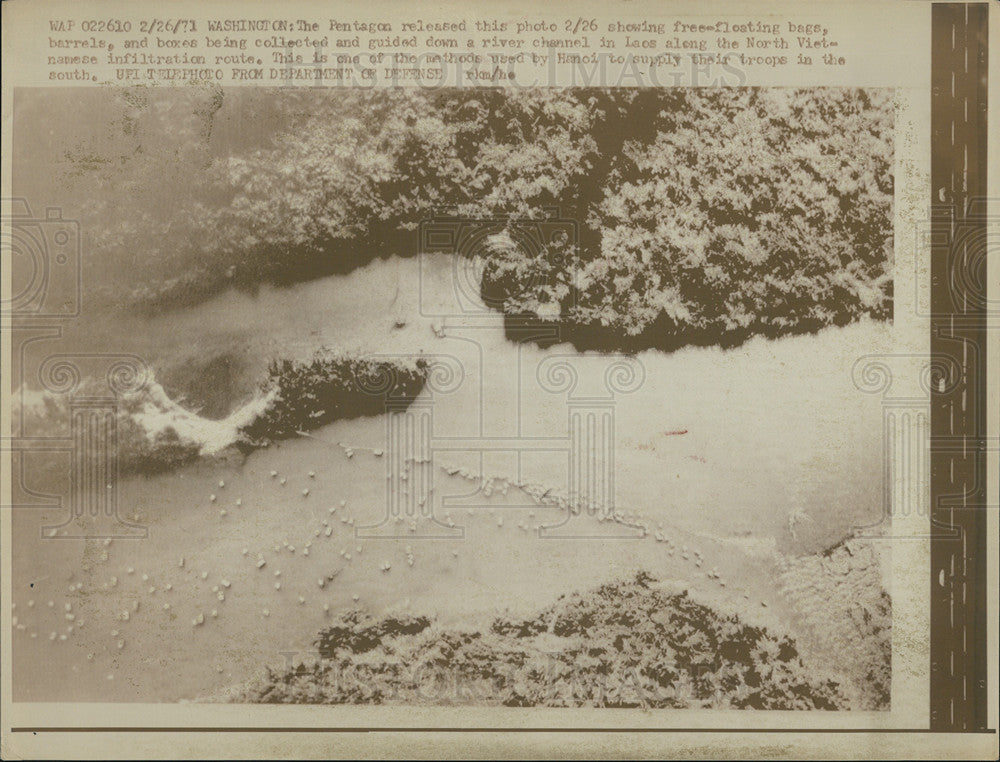 1971 Press Photo Boxes and bags floating in Laos Channel in Vietnam - Historic Images