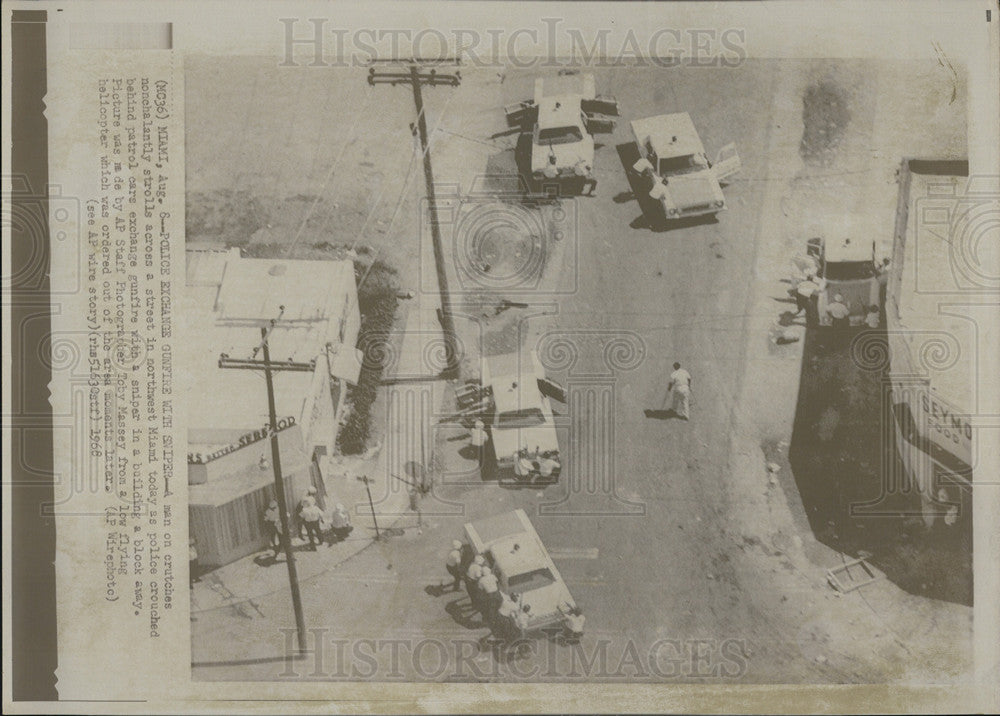 1968 Press Photo Police exchange gunfire with sniper in Miami. - Historic Images