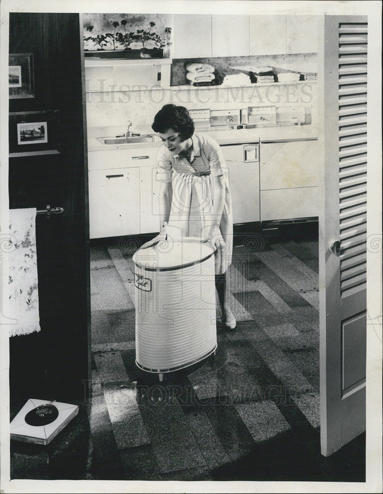 1961 Press Photo Clothing Oval Hamper Save Labor Family Wash Wheel Washer Dryer - Historic Images