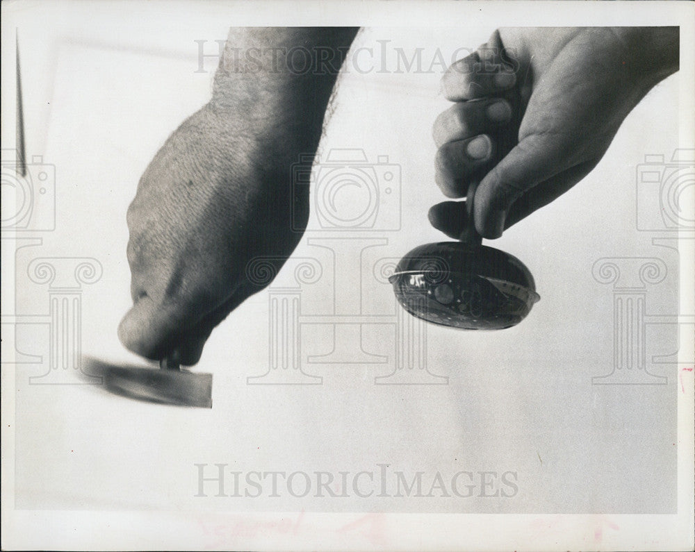 1966 Press Photo Hands Tell New Year&#39;s Eve Story Time for NoiseMakers and Death - Historic Images