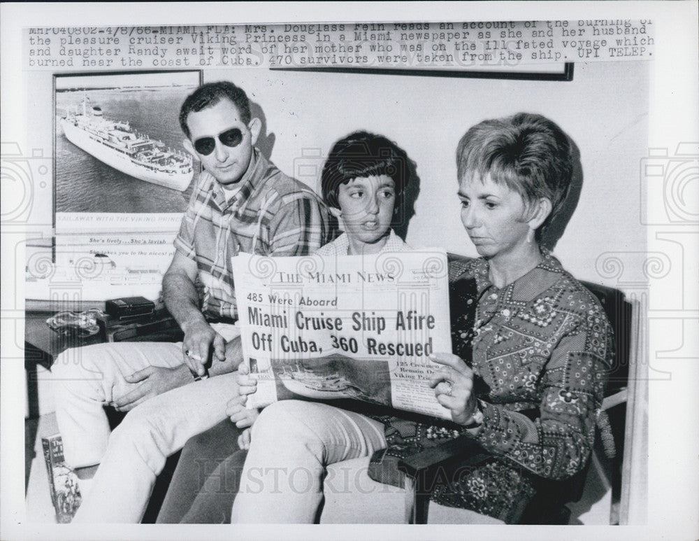 1966 Press Photo Mrs. Douglas Rein Reads an Account of Burning Cruiser Viking - Historic Images