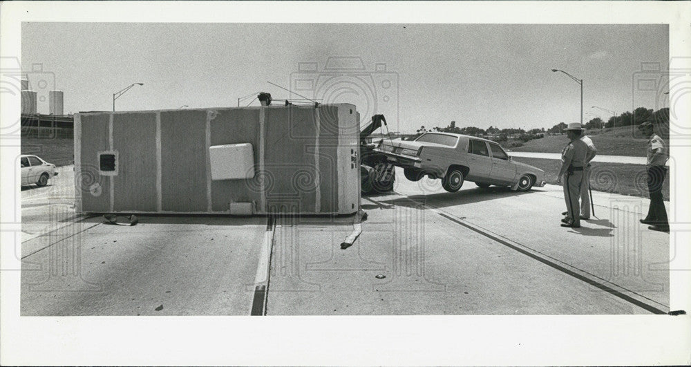 1980 Press Photo Travel Trailer Overturned - Historic Images