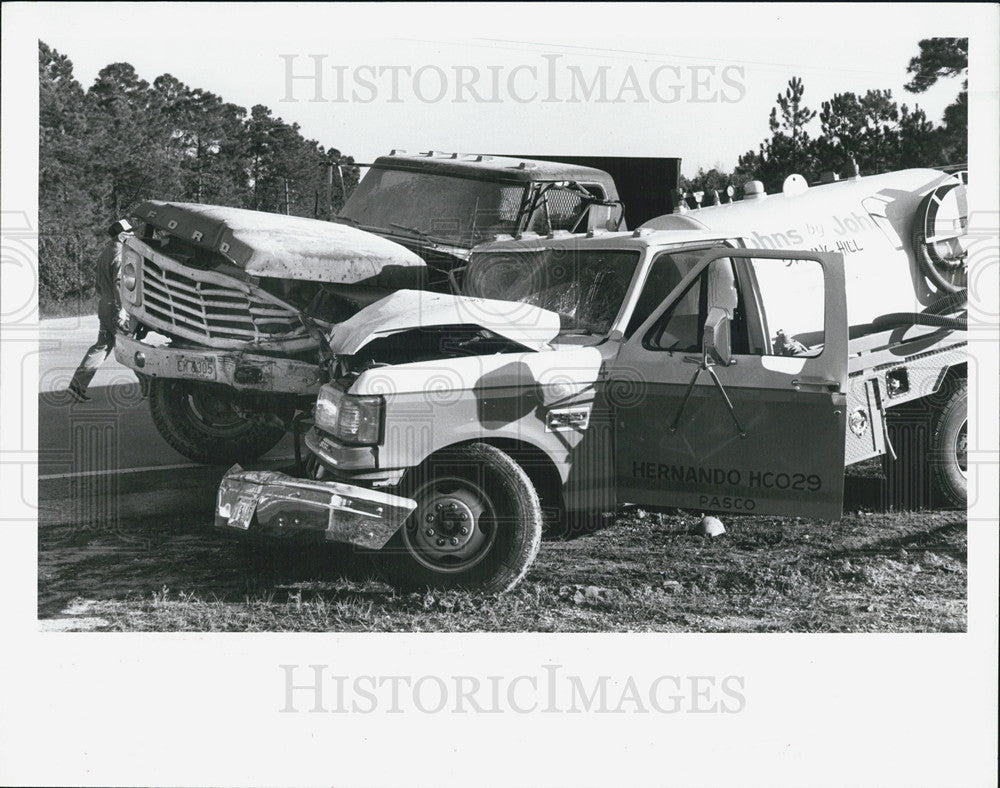 1988 Press Photo 2 trucks collided on State Road 595 drivers injured - Historic Images