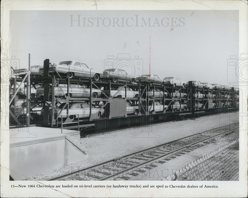 1964 Press Photo Chevrolets are loaded on tri level carriers going to dealers - Historic Images