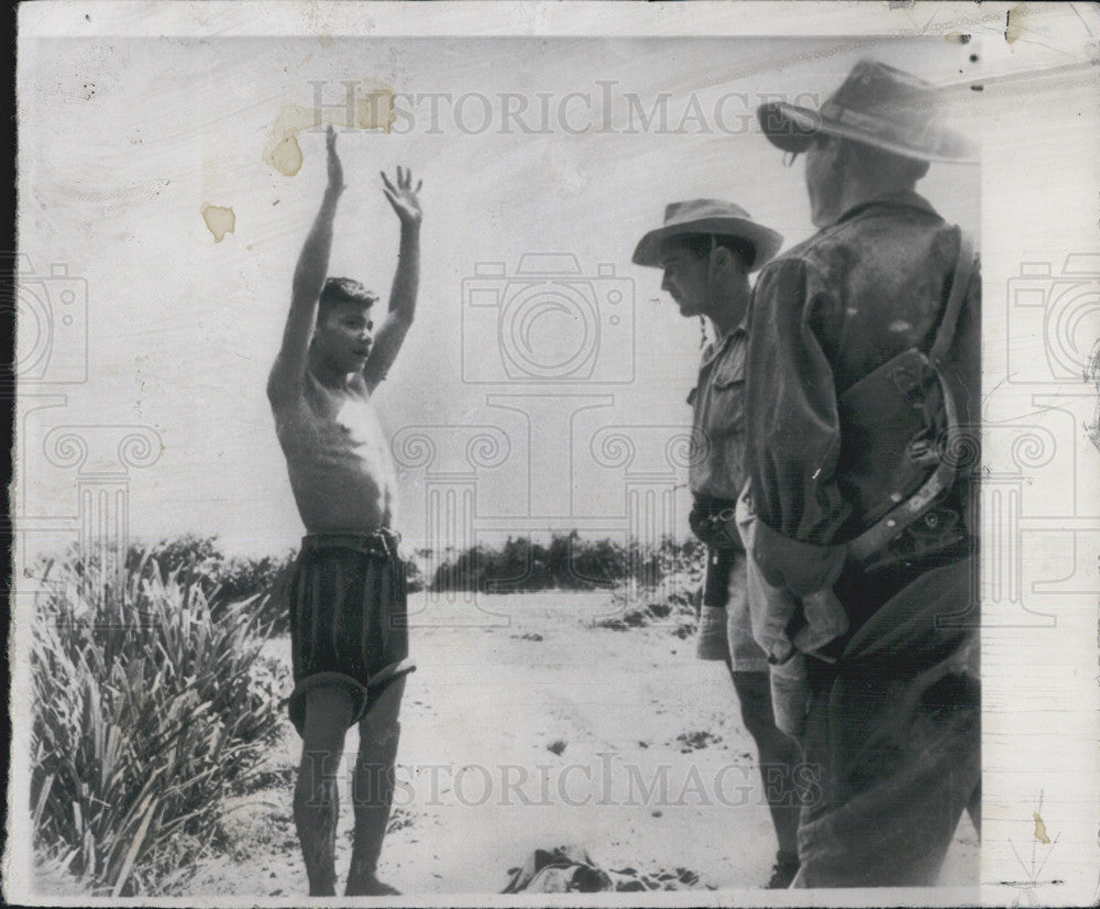 1950 Press Photo french Soldiers remove clothing for hidden weapons - Historic Images