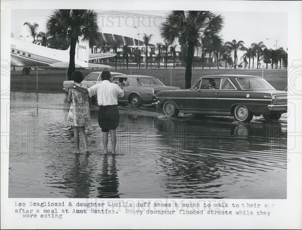 1969 Press Photo Leo, Lucille Scagliozzi, Heavy Downpour, Flooding - Historic Images