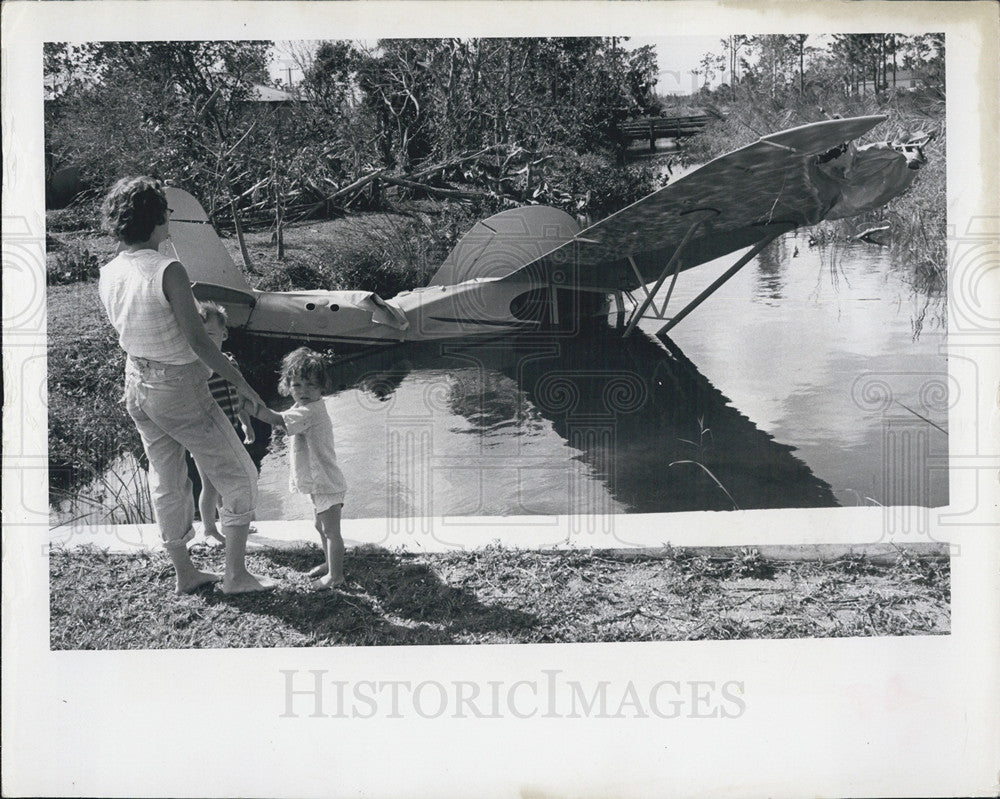 1960 Press Photo Plane Blown Into Creek by Hurricane - Historic Images