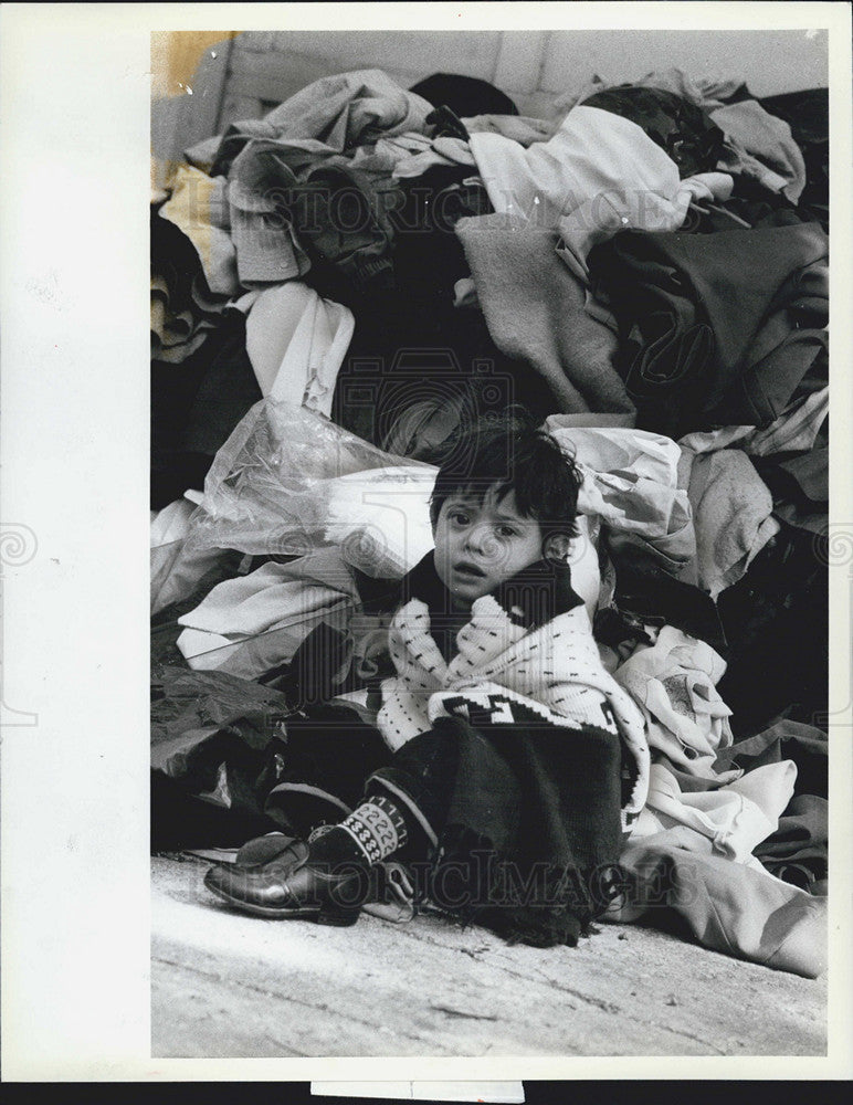 1982 Press Photo Javier Enriquez,4 sits in front of his family&#39;s belongings... - Historic Images