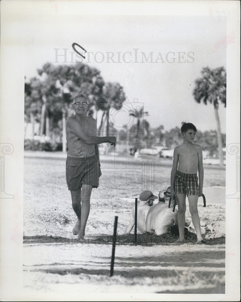 1967 Press Photo RL Barber Tosses Horseshoes With Grandson On New Years Eve - Historic Images