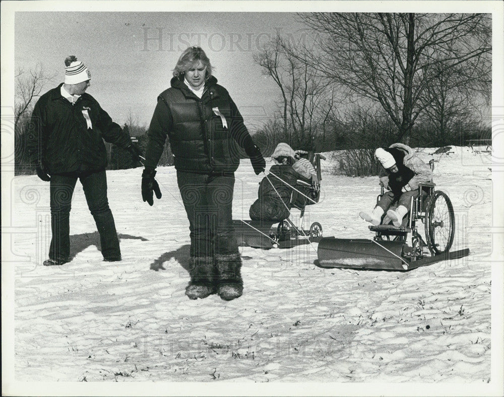 1980 Press Photo Michigan Handicapped Children Sledding - Historic Images