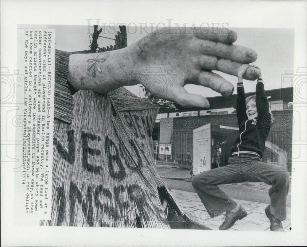 1954 Press Photo Boy Hangs From Large Hand In Berlin Playground From Theater Prp - Historic Images