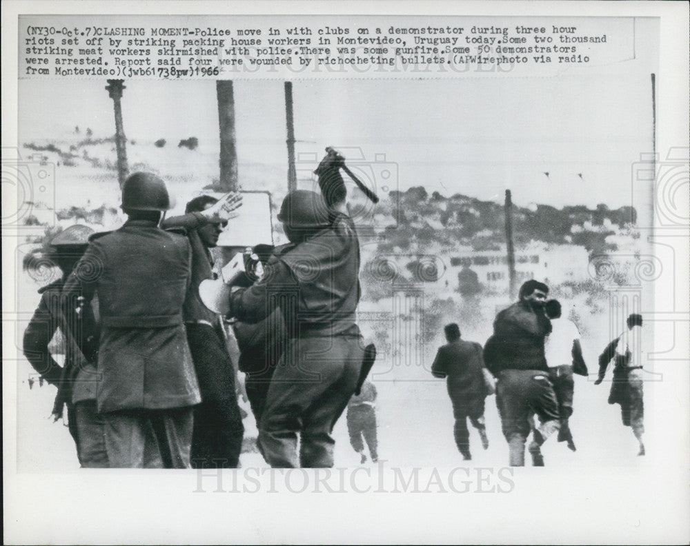 1966 Press Photo Uruguay Police Move In With Clubs On A Demonstrator - Historic Images