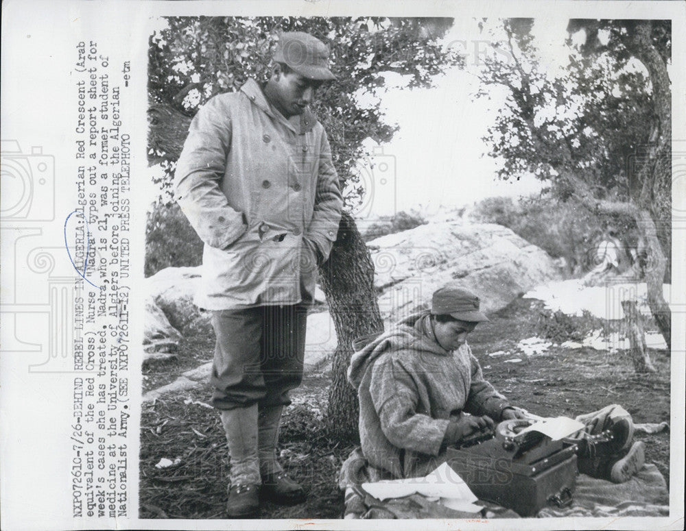 1957` Press Photo Algerian Red Cross workers nurse tpes out report sheet for - Historic Images