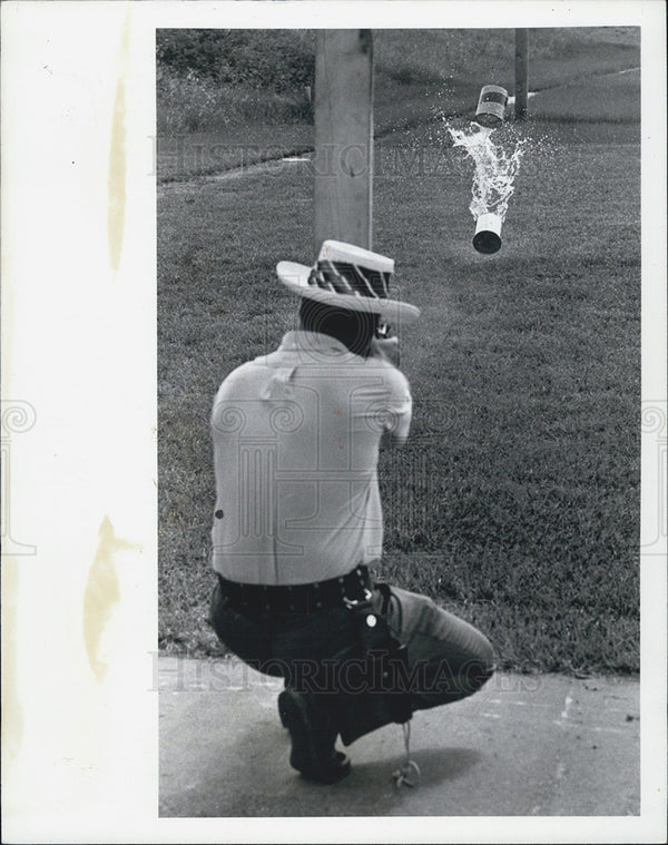 of Ron Getman demonstrates shocking power of 22 cal pistol. 1975 ...