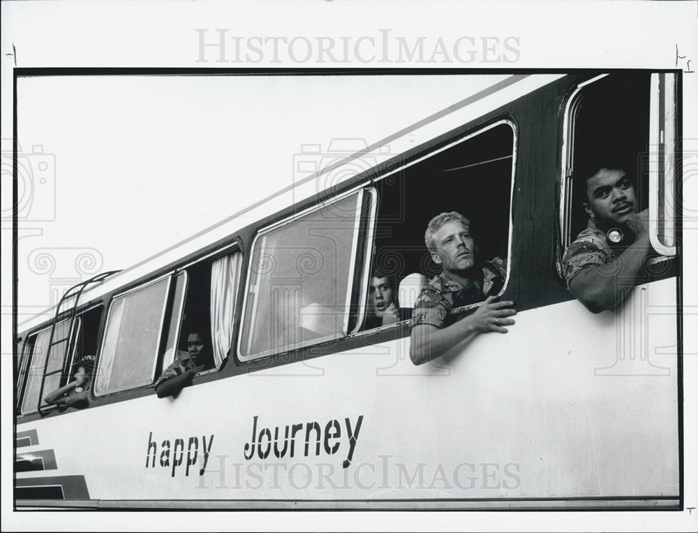 Press Photo Tourists Ready Themselves for Bus Ride - Historic Images