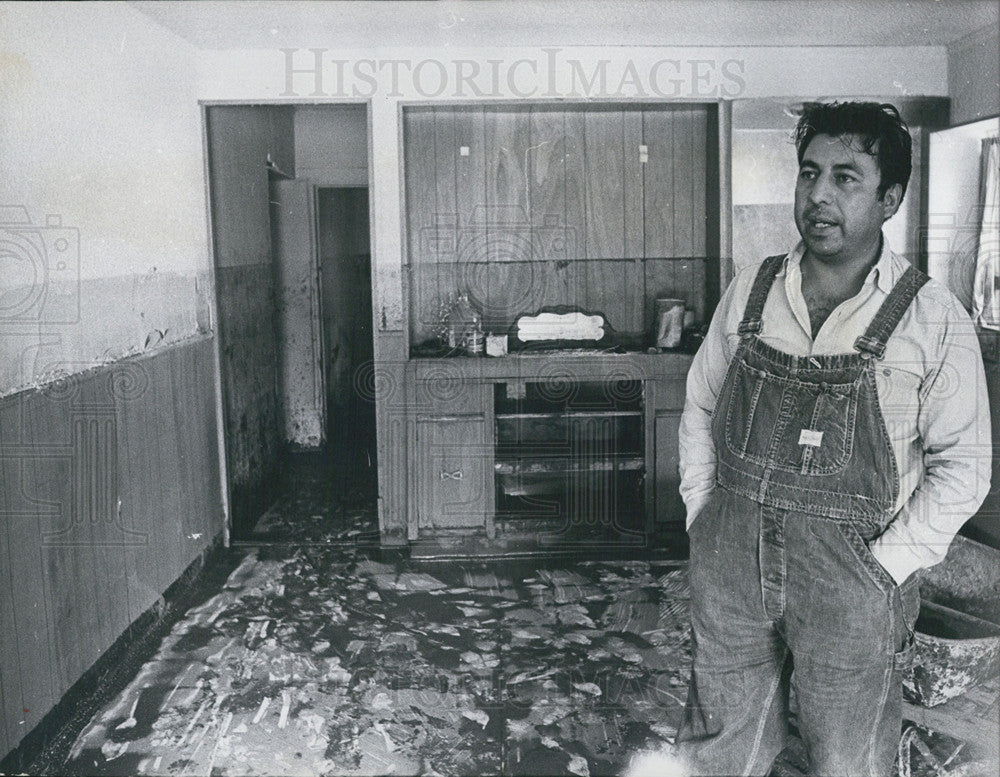 1965 Press Photo Everett Trujillo in his home after floodwaters receeded - Historic Images