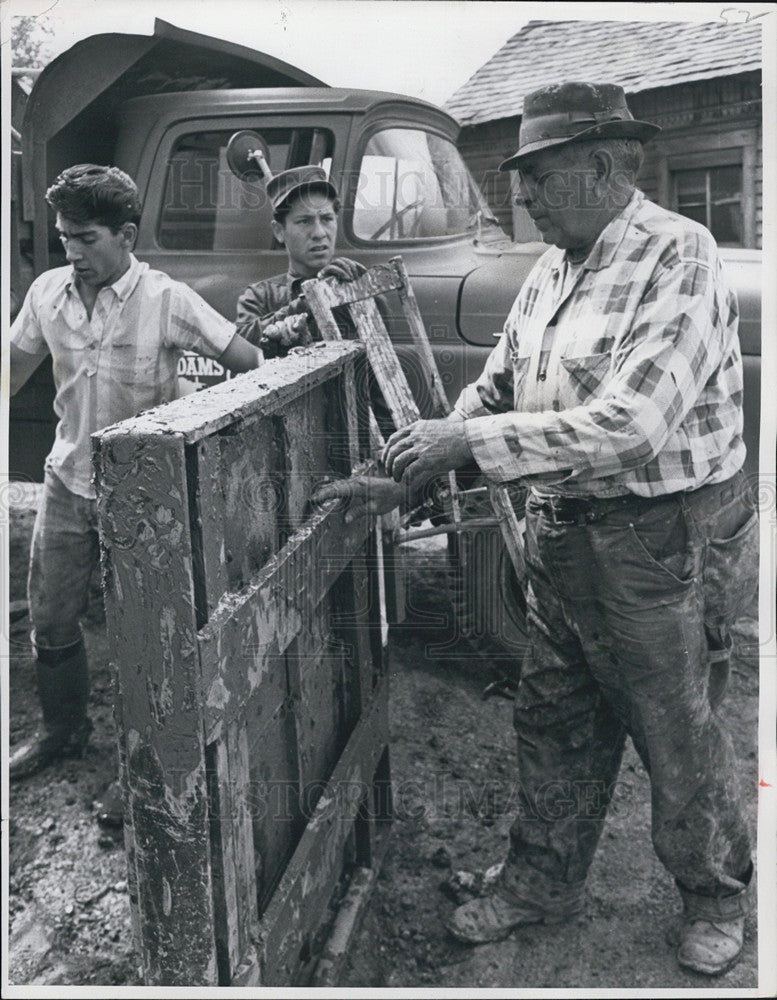 1965 Press Photo Men Loading Damaged Goods Onto Truck Denver Carbone Home - Historic Images