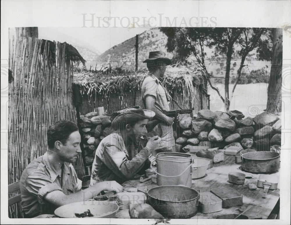 1956 Press Photo A French Solider Stands Guard as his buddies Have Chow - Historic Images