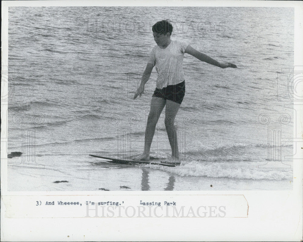 1973 Press Photo Child Surfing at beach Lassing Park - Historic Images